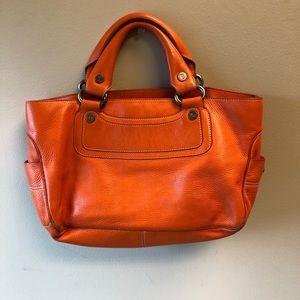 Orange leather handbag